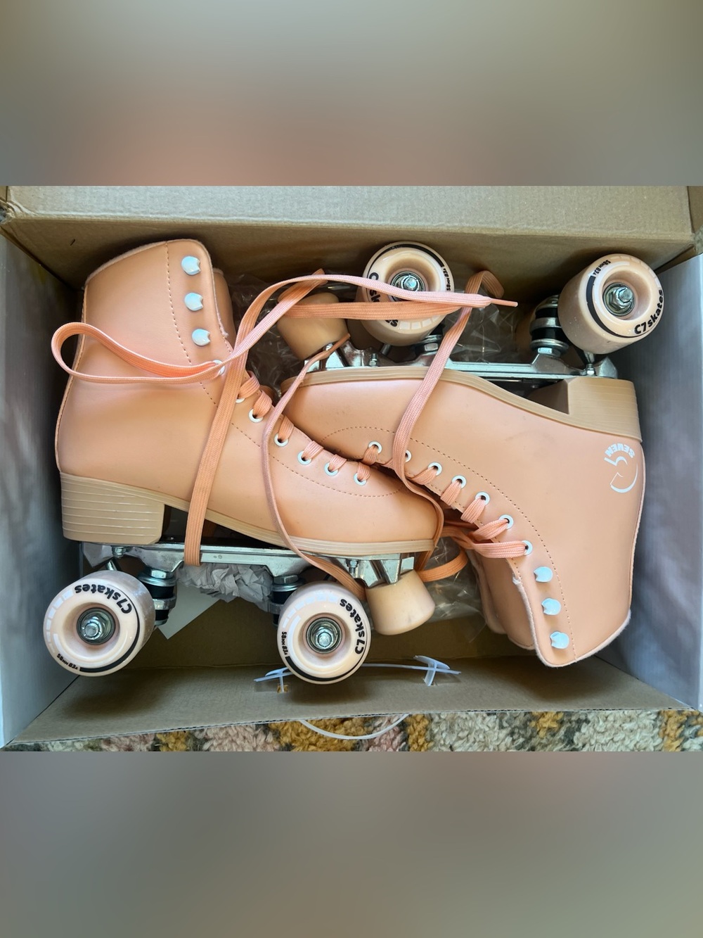 C7 Peach Roller Skates